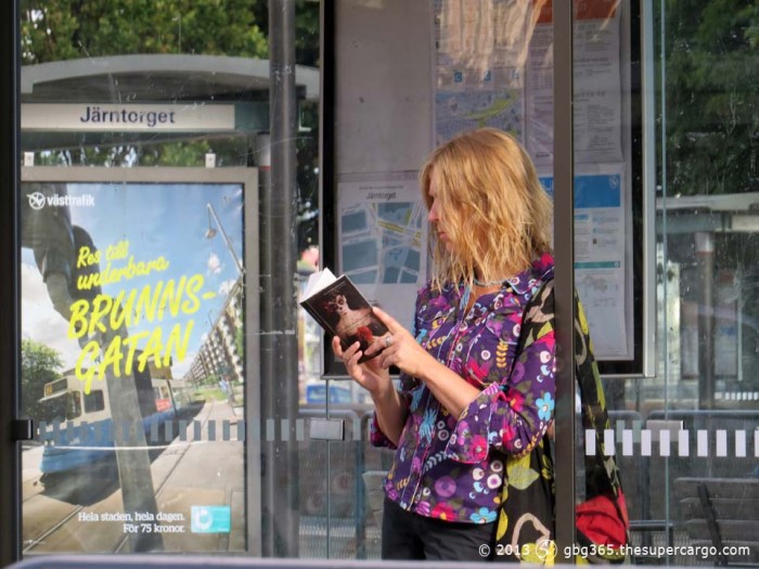 The reader at the bus stop