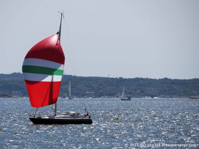 Red (white and green) sail in backlight